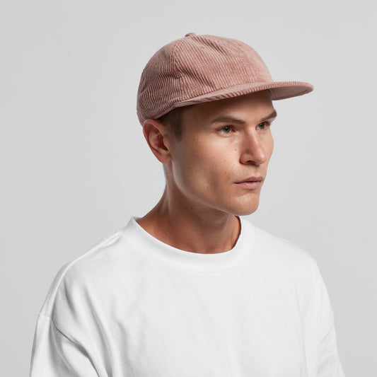 man in white tshirt wearing an as colour colour cotton corduroy cap in blush pink